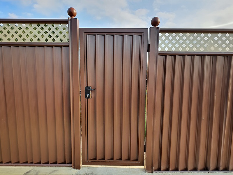 Close-up of a solid steel deluxe gate panel and latch